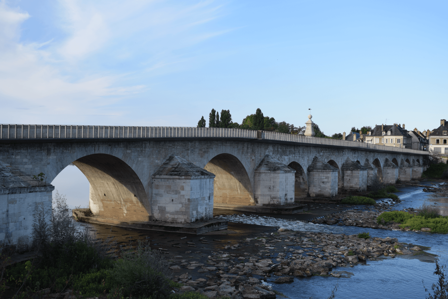 Stone bridge over a clear river